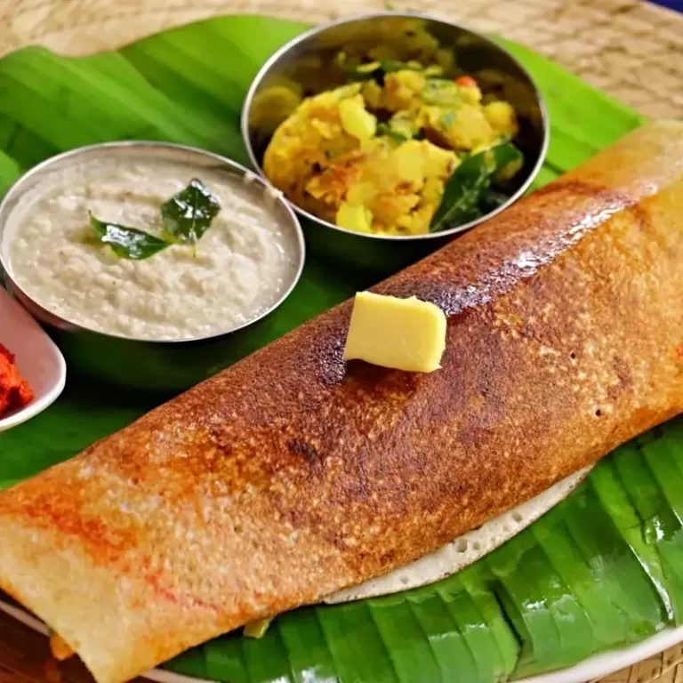 Crispy masala dosa served on banana leaf by caterers in Bangalore